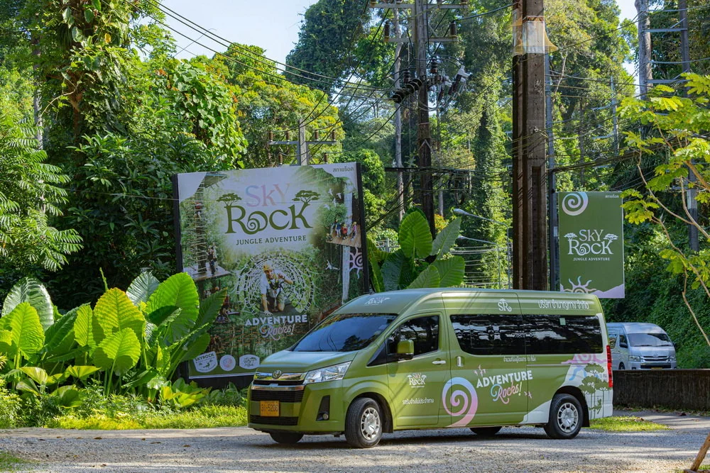 A Sky Rock branded van outside the park entrance